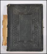 A 19th Century Victorian photograph album containing over forty photographs. The photo album