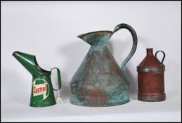 A 20th Century Castrol motor oil quart measure, together with another oil can of cylindrical form