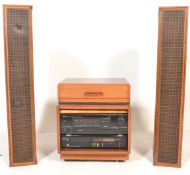 A vintage 20th Century teak wood cased music cabin