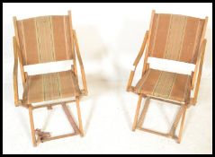 A pair of vintage early 20th Century folding camping / picnic chairs, wooden frame with original