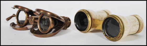A pair of 19th Century Victorian opera glasses having brass fittings and turning wheel to centre