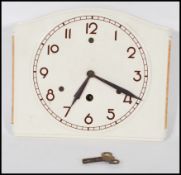 An early 20th Century Art Deco ceramic wall clock