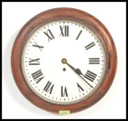 A 19th century Victorian mahogany station clock of circular form having a fusee brass movement.