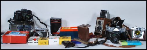 A good collection of pentax cameras and accessories to include Zenit-e, Minister 3, Centon K200...