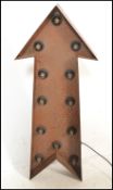 A vintage style Industrial 20th century  directional light in the form of an arrow, constructed from