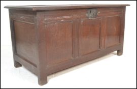 A 17th / 18th Century oak country coffer chest, fielded panel sides and top raised on stile
