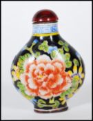 A 20th Century Chinese cloisonne scent bottle, having floral detailing with blue and white geometric
