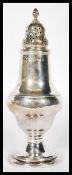 A believed early 19th century George III silver hallmarked sugar caster being hallmarked for date