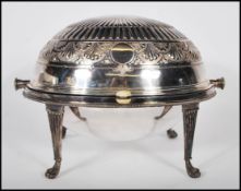 A stunning large Edwardian silver serving tureen with integrated roll over lid of egg form with