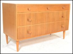 A retro 20th Century teak wood Danish inspired sideboard / credenza, having a configuration of three