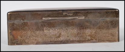 A silver hallmarked desk top cigarette case by Walker and Hall. Engined turned top to the hinged lid