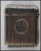 A 19th Century Victorian silver hallmarked chase engraved match vesta with central cartouche,