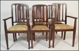 A set of six early 20th Century Edwardian mahogany dining chairs two being carvers, the rail back