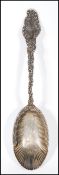 A 20th Century stamped sterling silver serving spoon having a gadrooned bowl having scrolled
