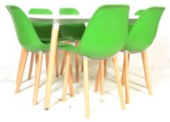 A contemporary white laminated and ash dining table. The table comprising of a laminated wooden