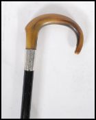 A early 20th Century 1920's silver collared promenade walking stick cane having horn crook handle