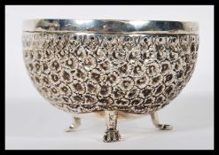 An unusual Siam silver 3 legged sugar bowl being cast in relief with geometric decoration.Unmarked