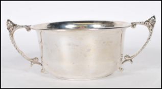 A silver hallmarked twin handled pedestal bowl, scroll handles with acorn finial, Birmingham