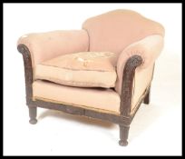 A 1920's Bergere armchair. Raised on carved legs w