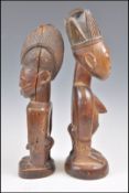 A MALE AND FEMALE PAIR OF WOODEN YORUBA IBEJI
