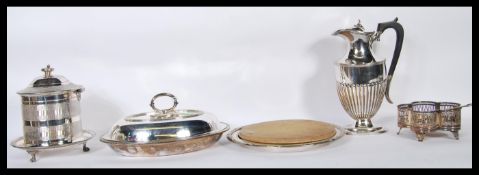 A collection of silver plated items to include a silver plated Elkington  & Co bread board, muffin