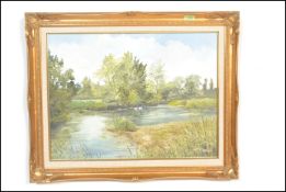 An oil on canvas painting by Dorset artist Denys Garle depicting Swans from the river bank