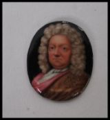 A 19th Century hand enamelled portrait miniature on metal of oval form depicting a Georgian