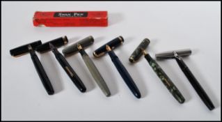 A collection of six vintage fountain ink pens to i