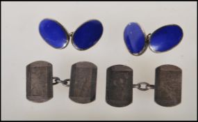 Two pairs of silver cufflinks one set being oval having blue enamelled front united by chains,