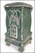 A large 20th century faux French painted green and silver upright pedestal room  heater in the