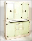 A stunning mid 20th Century kitchen larder cupboard, having a series of cupboards and drawers with