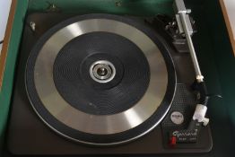 A vintage 20th Century teak cased Deccadec by Decca turntable record player, fitted with a Garrard