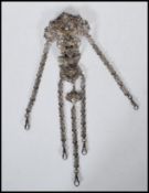 A Victorian silver white metal chatelaine having c