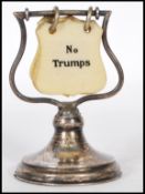 A early 20th Century Vintage silver filled Trump card indicator for the game of Bridge, having