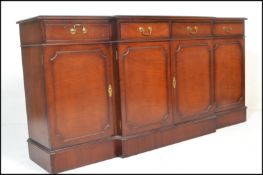 A large Georgian revival mahogany breakfront sideboard / dresser. Raised on a plinth base with a