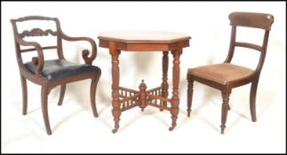 A 19th Century mahogany Victorian penny / centre table of octagonal form having castors and turned