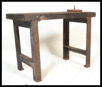 An early 20th Century industrial work bench, the b