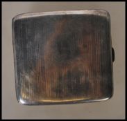 An early 20th Century hallmarked silver cigarette case by Asprey of London of curved rectangular