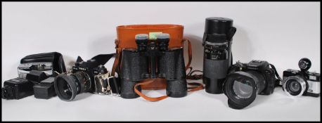 A collection of vintage 20th Century 35mm cameras, Yashica, Olympus, camera lens,  digital camera by