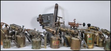 A collection of vintage 20th Century brass and copper blow torches to include many makes such as