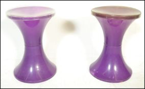 A pair of vintage 1960's Habitat Tam Tam stools in a purple tone colourway, the inverted body of the