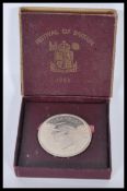A silver Festival of Britain 1951 crown coin complete in the presentation box. Weight 28.1g.