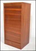 A mid century teak wood tambour fronted office Industrial filing cabinet. Of pedestal form having