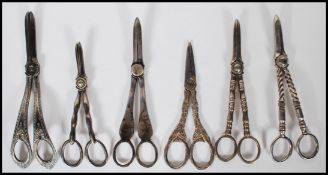 A collection of silver plated grape scissors datin