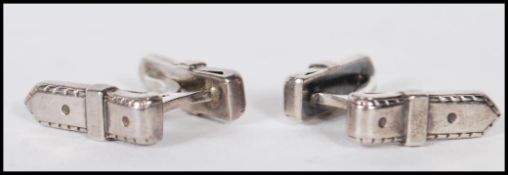 A pair of vintage mid 20th Century Hermes silver cufflinks in the form of belt loops. Marked Hermes.