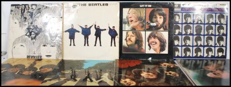 A collection of long play LP vinyl records pertaining to the Beatles and band members to include