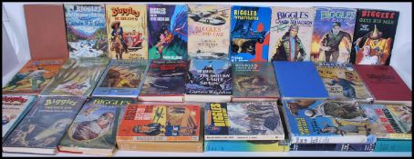 A collection of Captain W.E.Johns hardback books mostly Biggles 1st Editions to include Biggles