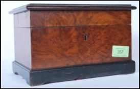 An early 20th Century wooden tunbridge jewellery box having geometric wooden inlay to the lid and