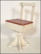A mid 20th Century scratch built childs swivel chair, the two tone chair painted chair having