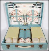 A vintage mid 20th Century Sirram picnic set hamper for four. Carry handle to the front of the